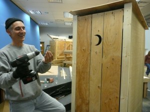 Joe Builds an Outhouse Joe Rotondo helps build an outhouse after the Challenge School fire.